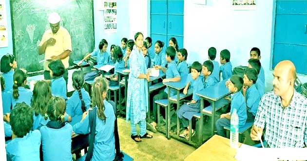 This is how the children will study? One building, two schools, one room and three classes!