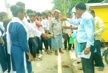 Weekly market started by breaking coconut on the road