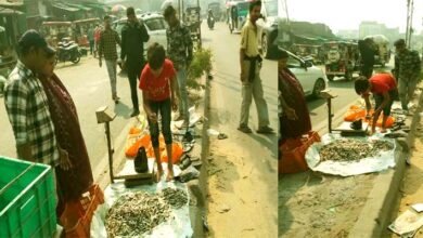 The divider on the Silav bypass four lane has become a fish market children are weighing fish the administration is silent
